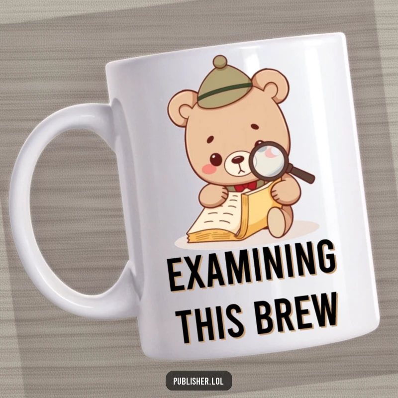 Funny Bear Investigator Mug showing a small bear in a tiny hat using a magnifying glass to inspect a manuscript.