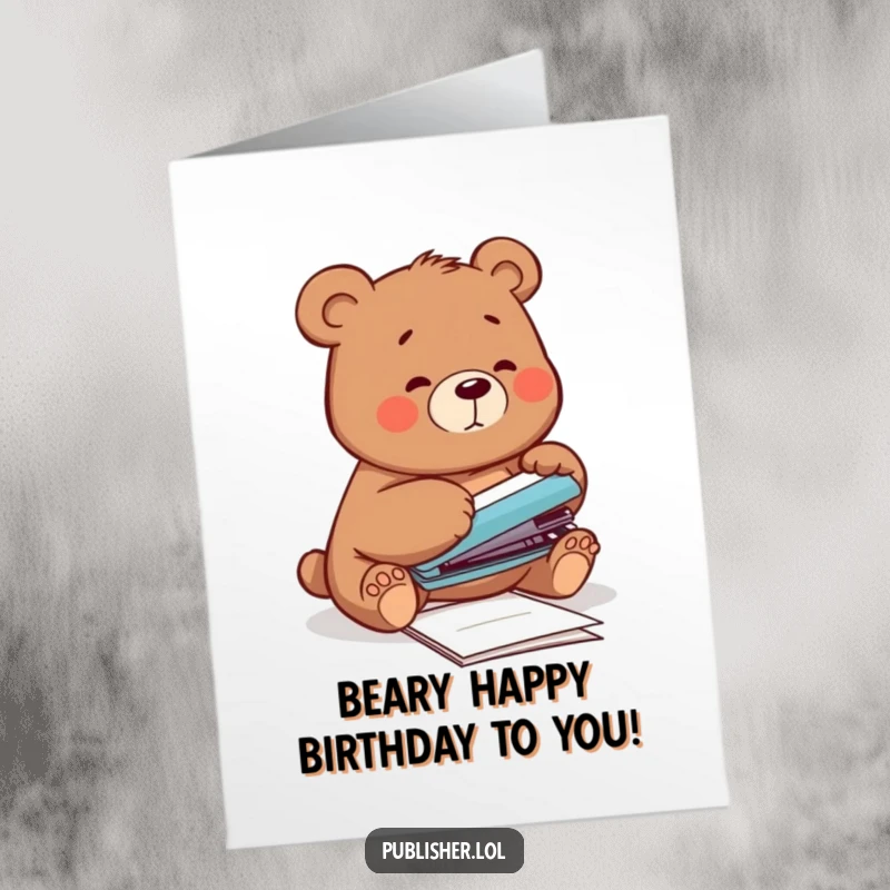 Funny Free Printable Bear Birthday Card: Clumsy bear struggling to staple papers with its paw, a comical birthday wish.